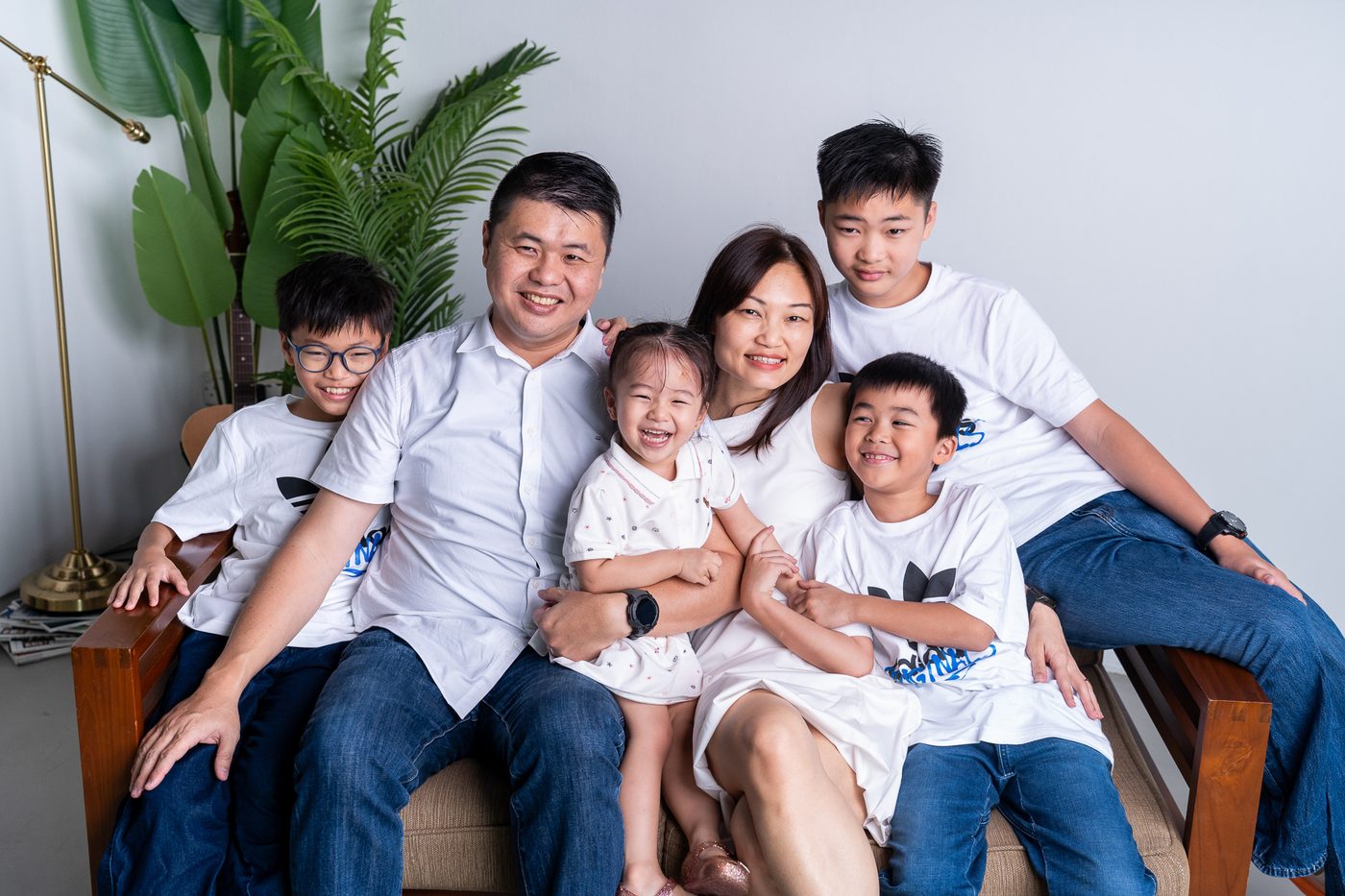 Family photoshoot Singapore — parents with children portrait studio session