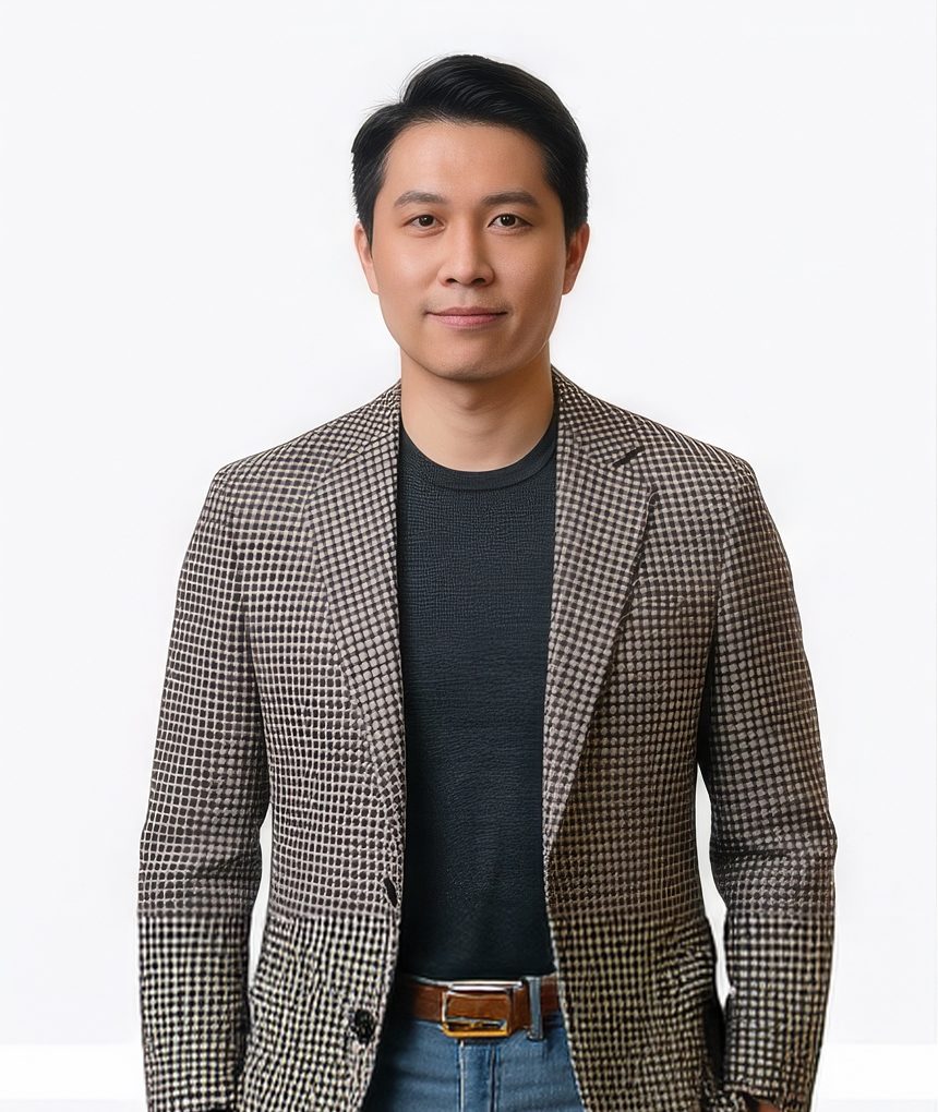 Man in a camel coat with black turtleneck for a creative LinkedIn headshot