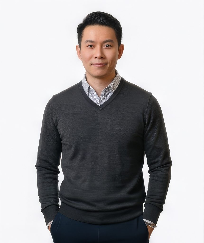 Man in a navy blazer with denim shirt for a tech LinkedIn headshot