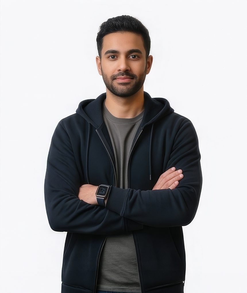 Man crossing arms in a navy hoodie for a tech LinkedIn headshot