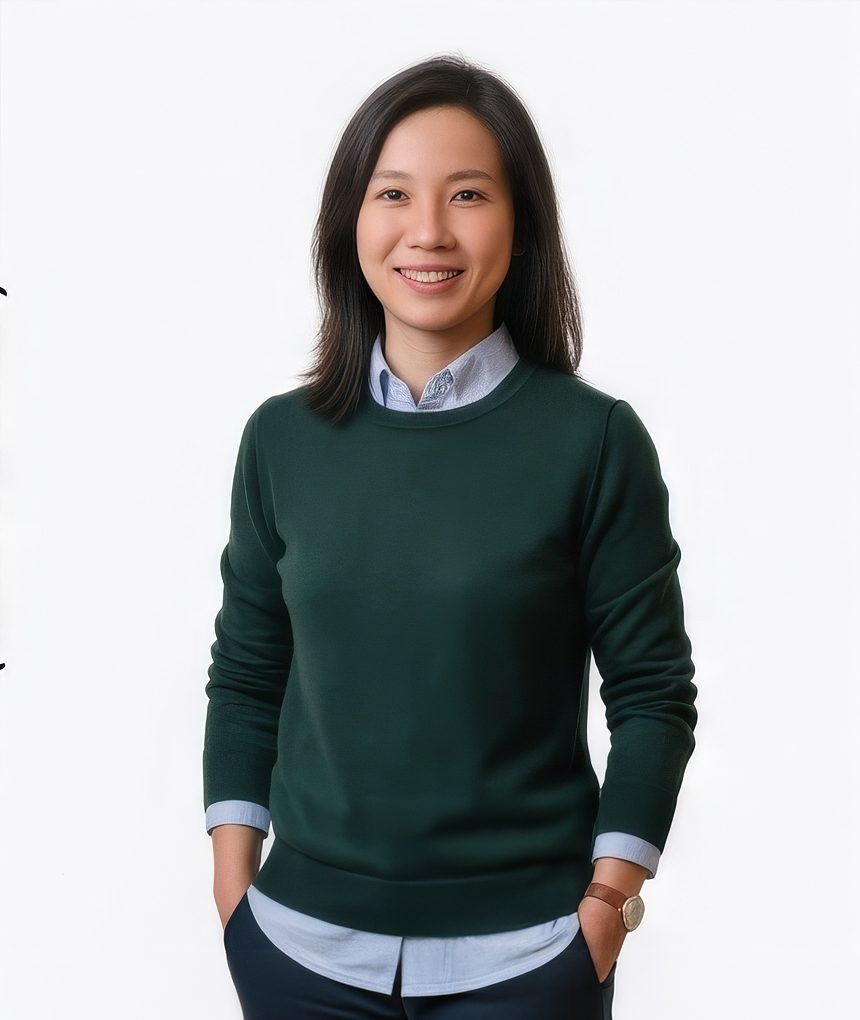 Woman in a dark green sweater with collared shirt for a tech LinkedIn headshot